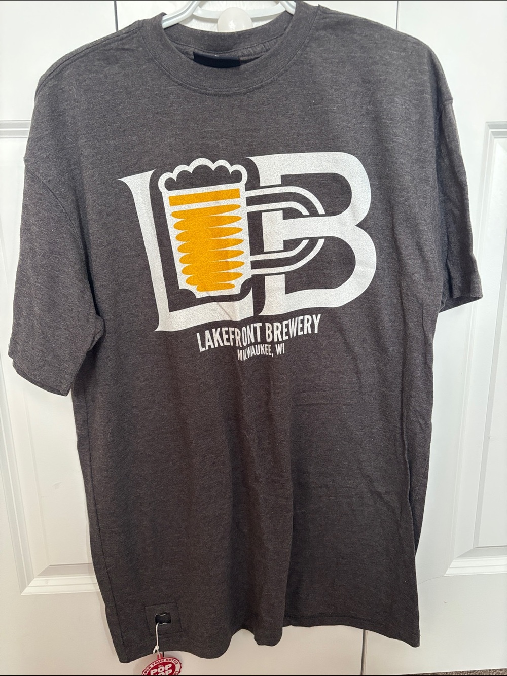 J. America Dark Gray Tee w/ Yellow & White Lakefront Brewery Logo Pop Top Large